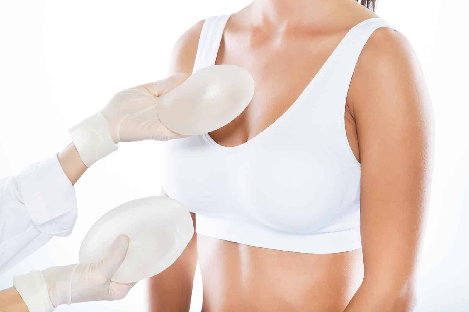 Female doctor choosing mammary prosthesis | Newport Beach, CA